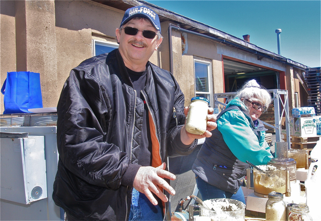 Tom Kruel of Flanders filled up a jar of horseradish for a guest.
