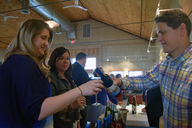 Winemaker Anthony Sannino pours a glass for Liz Person.