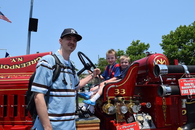 Brady Dwyer, 9, and Sullivan Dwyer, 5, of Cutchogue (seated) with their cousin brad Young of Augusta, Georgia.