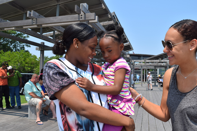 Drew Taylor of Riverhead, Adrienne Hardin, 4, and Jade Creighton of Greenport.