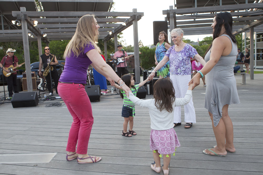 Moms dance with the kids.