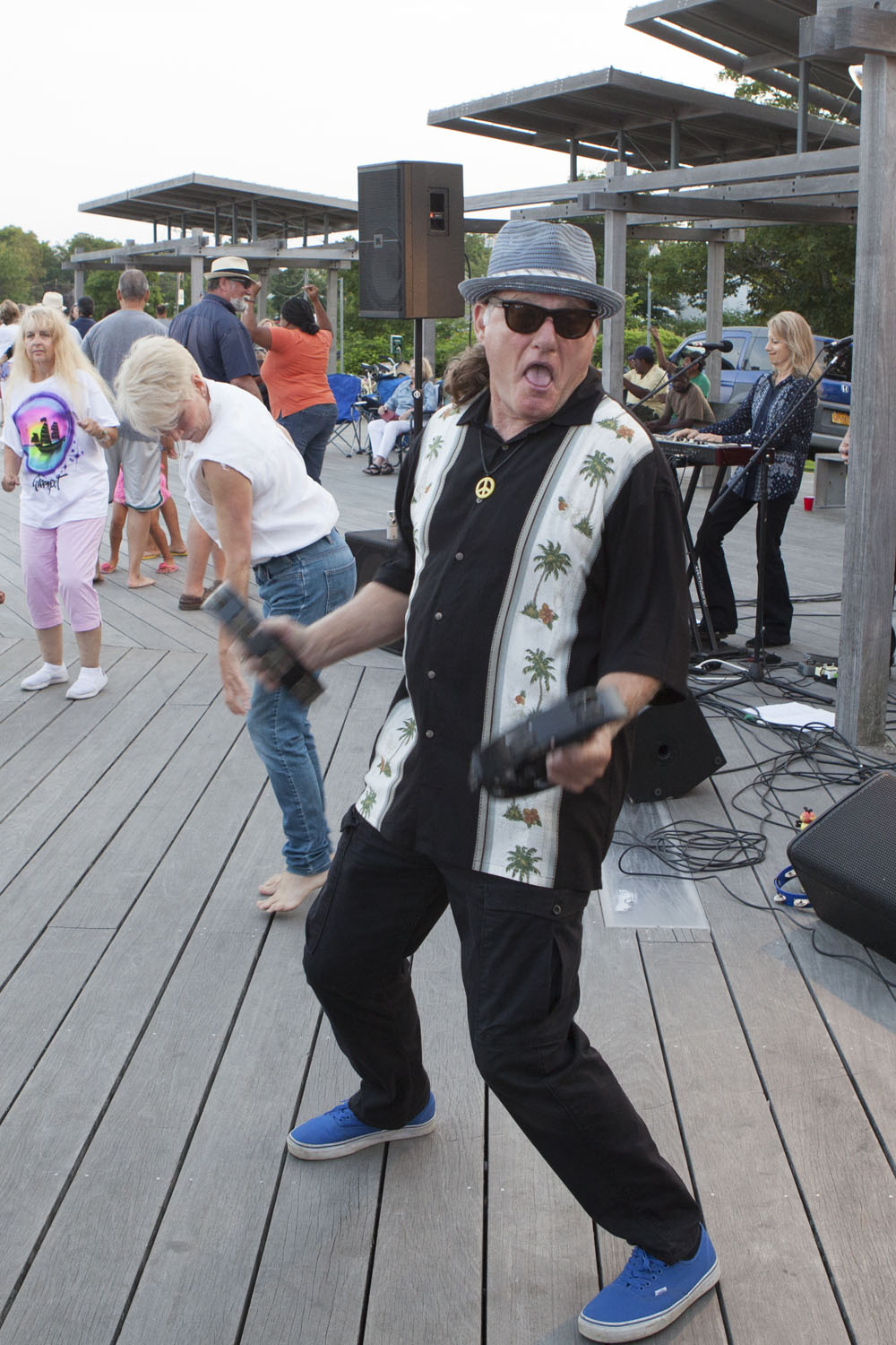 A member of the Bobby Nathan Band dances onstage.