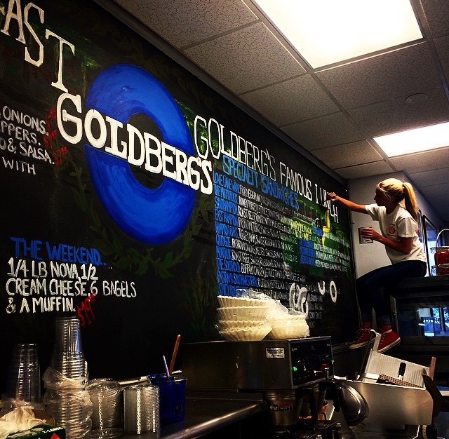 VanGorden paints a mural at Goldberg's Famous bagels in Mattituck. (Credit: Julie VanGorden, courtesy)
