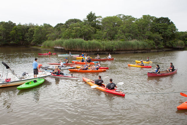 Kayakers organize themselves for the start of the race.