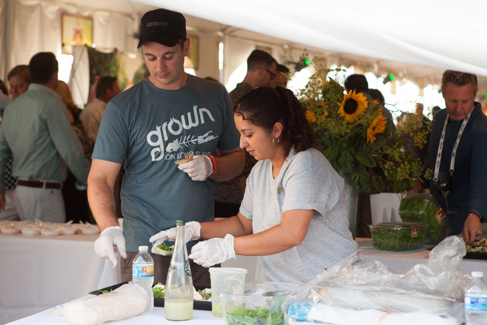Brian Curtin and Nohamy Monroy prepare samples for Satur Farms.