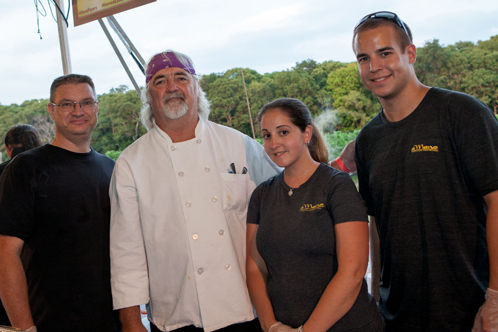 Restaurateur Tom Schaudel, second from left, with staff members David Hill, left, Michelle Holfester, and Kevin Chew.