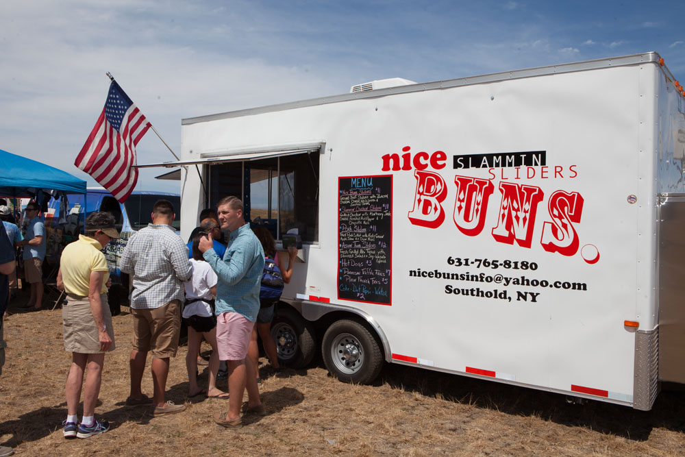 Southold's own Nice Buns Slammin' Sliders serves customers. Food trucks were new at this year's festival.
