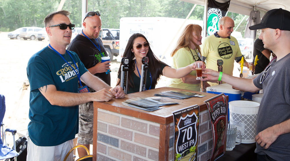 Nate Payne, left, and Vanessa Bedson, right, of Crooked Ladder Brewing Company.