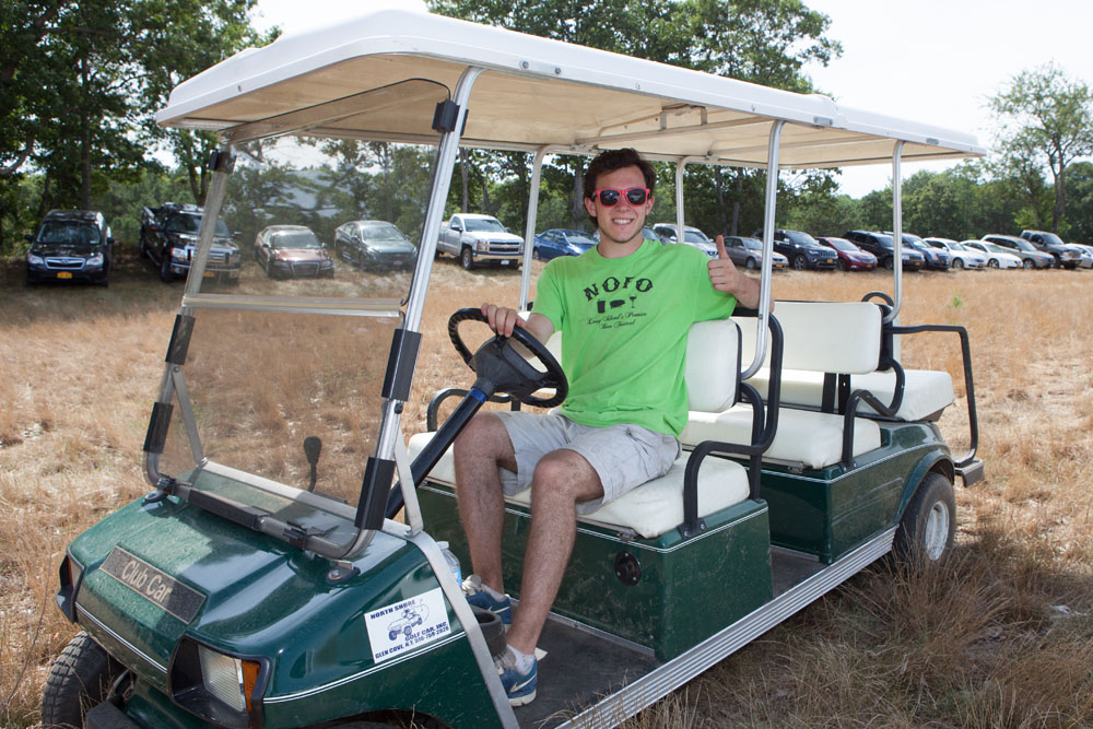 Danny Smith of Boston drives one of the many trolleys running to and from the parking areas.