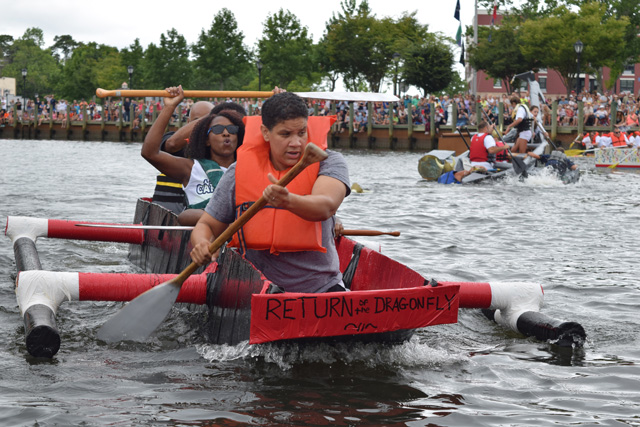 Deawna Harris (back) and Kerri Harris of Dover, Delaware and their team "Return of the Dragonfly" tak first place in their heat.