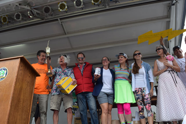 Members of the League of Awesome Carboard Boat Racers accept their award for best costumed crew.
