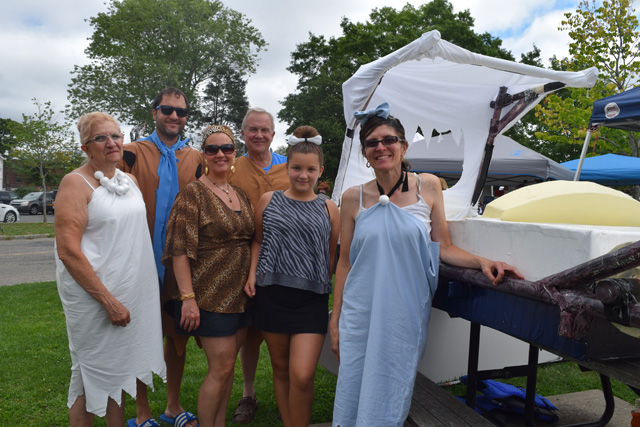 Marie Stiles of Bohemia (Wilma Flintstone), Rob Stiles of East Moriches (Fred Flintstone), Christine and Isa Hollander (Pebbles Flintston) of Bohemia, Bob Stiles of Bohemia (back, Barney Rubble) and Barbara Aylward of Bohemia (Betty Rubble.)