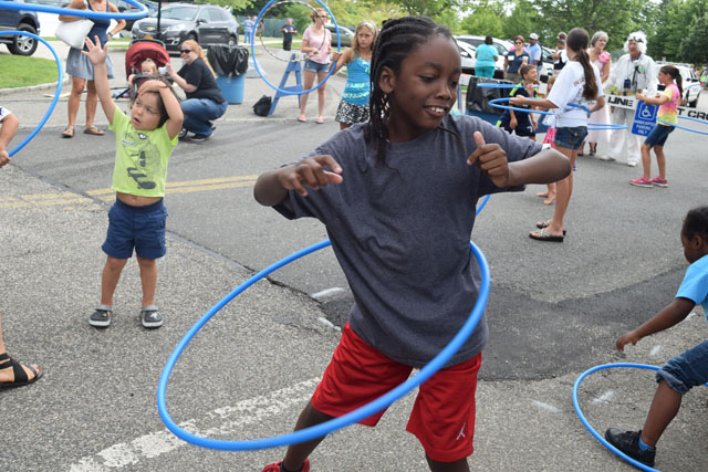 Jovan Trent, 9, of Riverhead participates in the hula hoop contest.