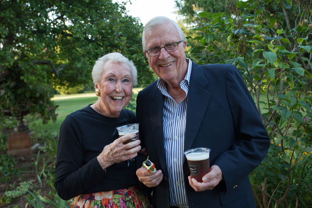 Ginny Byrnes and Bill Osler enjoy a cold beer in the garden. (Credit: Katharine Schroeder)