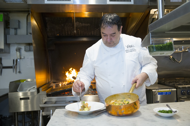 Chef Marco Pellegrini in the kitchen at Caci North Fork. (Credit: Randee Daddona)