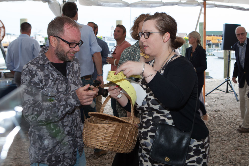 Melvin Scarberry of Shelter Island buys raffle tickets from volunteer Devon McLaughlin.