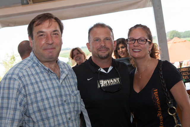 Palmer Winemaker Miguel Martin, left, with Vinny and Natalie Vitale of Shirley.