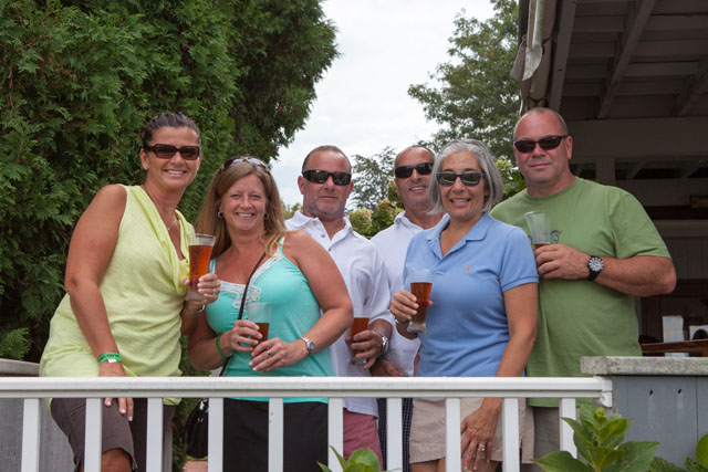 A group of friends from Patchogue and Blue Point enjoy the wine and music.