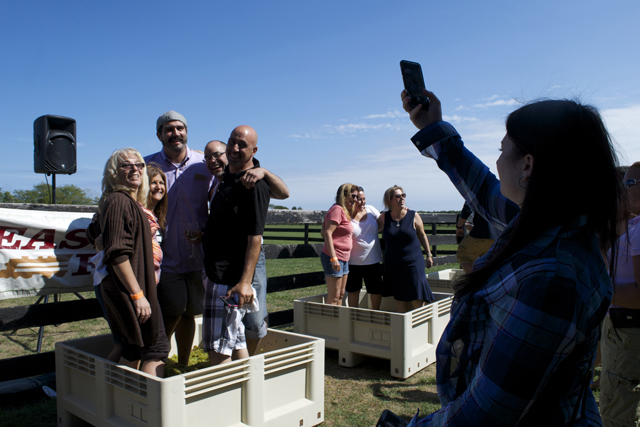 A group of grape stompers pose for a photo with Martha Clara winemaker Juan Micieli-Martinez (center).
