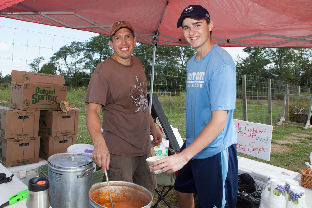 Will Stoner, left, and Patrick Orlando serve up Garlic Castillian soup.