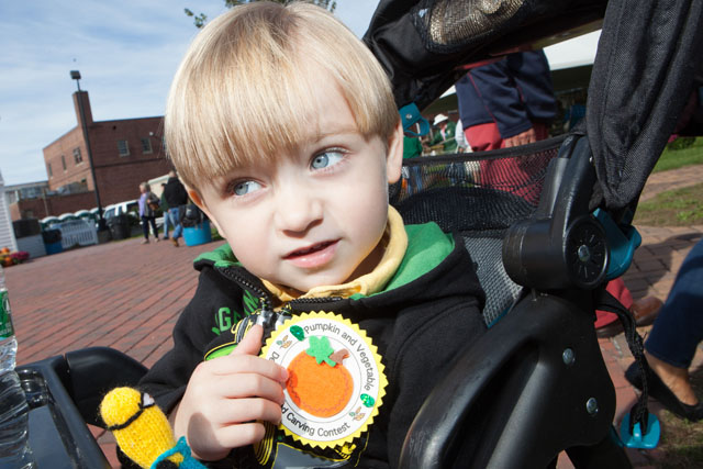 Cayden shows off his award.