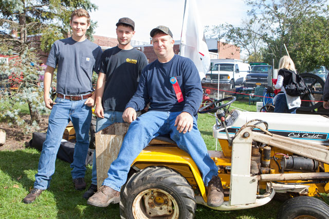 From Long Island Antique Power Association, from left: Tyler Shepherd, Mike Young, and Gene Shepherd with a Cub Cadet.