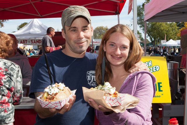 Nick Luparella and Tara Arichabala show off their stuffed potatoes. The potatoes were grown in Riverhead.