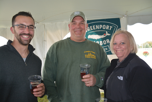 Kevin Pollack Jr., Kevin Pollack Sr. of Country View Farmstand in Southold and Eileen Cushman of Mattituck enjoyed the day. (Credit: Monique Singh-Roy)