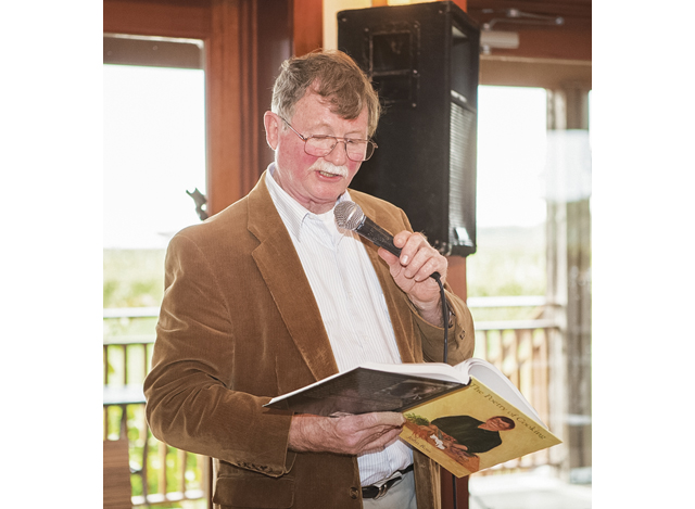 John reads one of his favorite poems from his book. (Credit: Katharine Schroeder)