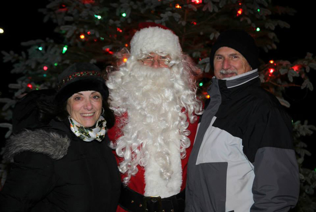 Jane Alcorn, president, and Gene Genova, vice president of the Tesla Science Center at Wardenclyffe, with Santa at last year's tree lighting. (Credit: Tesla Science Center)