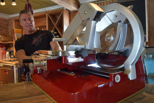 Nick DeCillis shows off the fly wheel slicer at the soon-to-open Basso in Greenport. (Credit: Vera Chinese)
