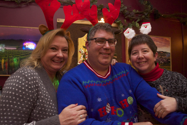 Debbie Consentino of Aquebogue and Tim and Cindy Anderson at Vines and Hops.