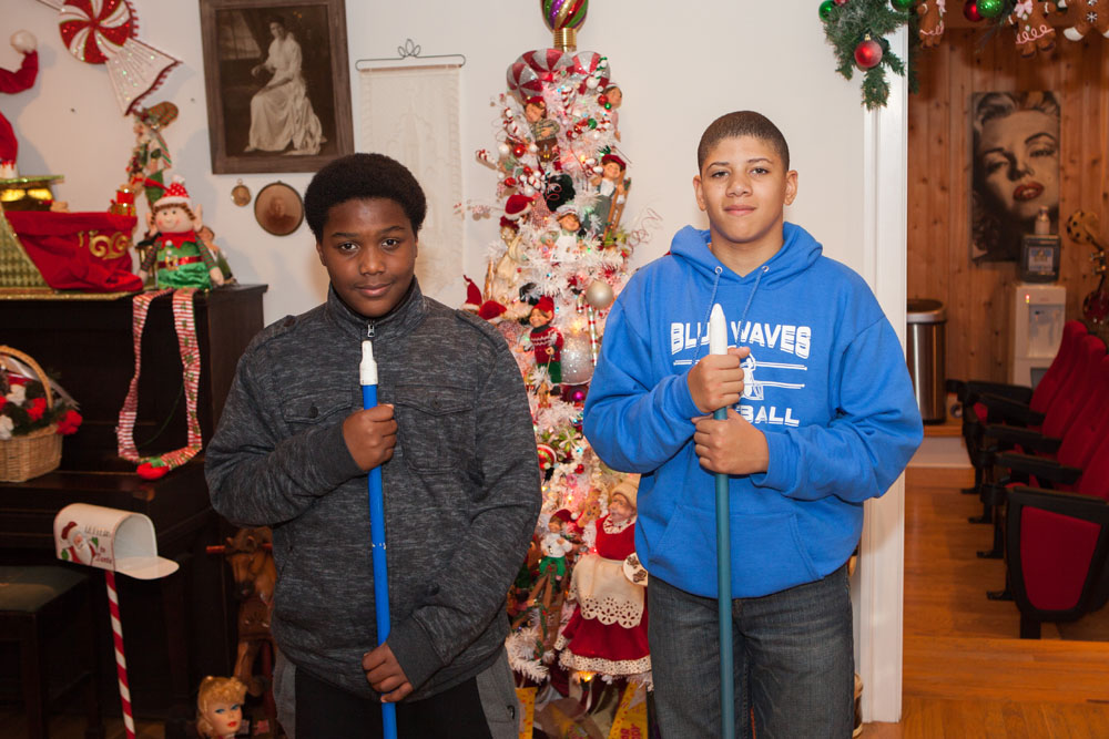 Amariyon Leggon, 13 and Jahari Pittman, 12, both of Flanders, help out at the house tour.