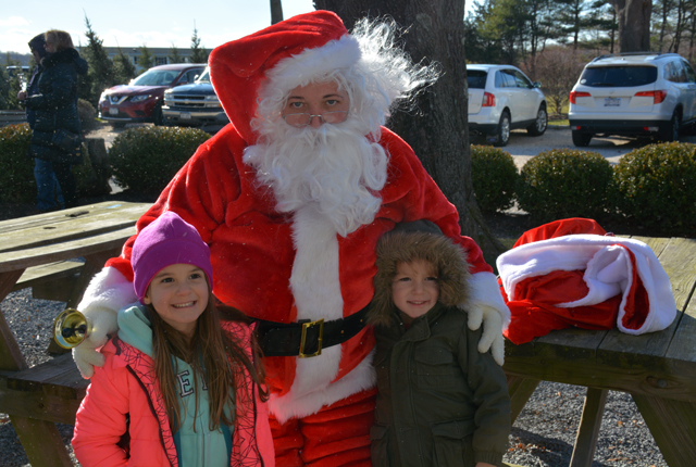 Santa stopped by to pose for pictures with Seren Lewis, 5 of Cutchogue and Emmet Dufour, 4 of Baiting Hollow.