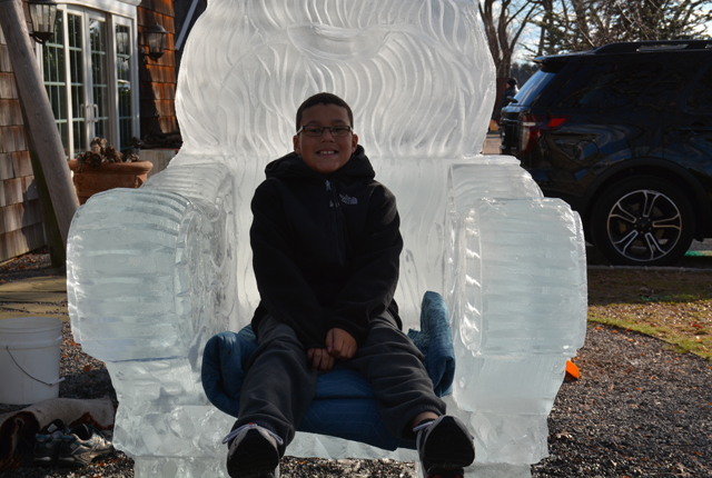 11 year old John Brown of Mastic tries out Santa's Throne.