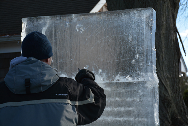 Rich Daly sketches out his design before carving begins.