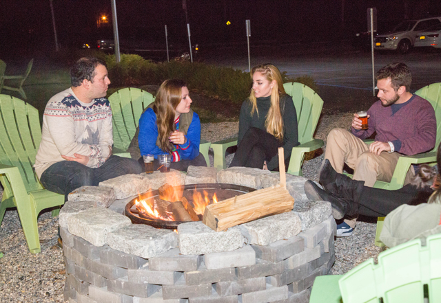 A group of Southold residents get warm by the fire.