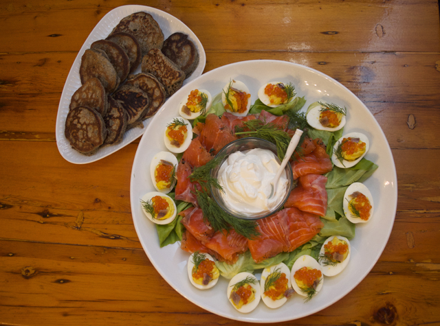Deviled eggs and salmon caviar served with buckwheat blini and gravlax. (Credit: Vera Chinese)