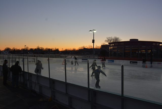 Skaters ice skated by twilight as the sun set in Greenport