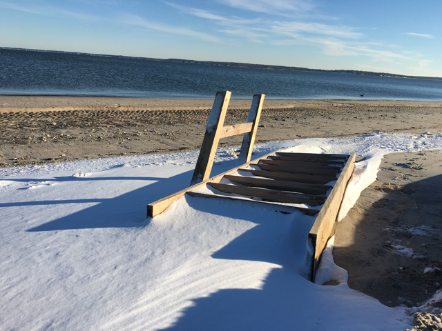 A snow-covered ladder at South Jamesport Beach.