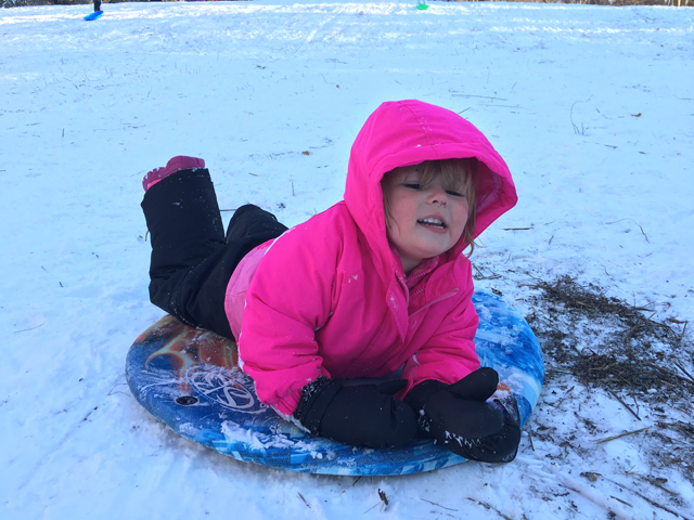 Layla Valderrama, 2, of Mattituck sleds down the hill near Maratooka Lake in Mattituck.