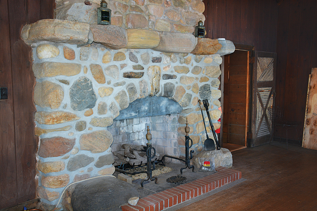 The stone fireplace inside the main room of the cabin. (Credit: Monique Singh-Roy)