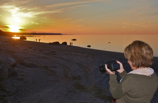 Donna Wish of Manorville testing the setting on a new camera at Reeves Beach Monday.