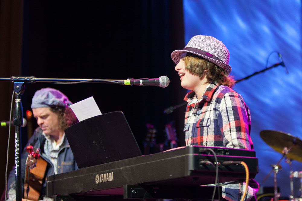 Cole performs a song he wrote.