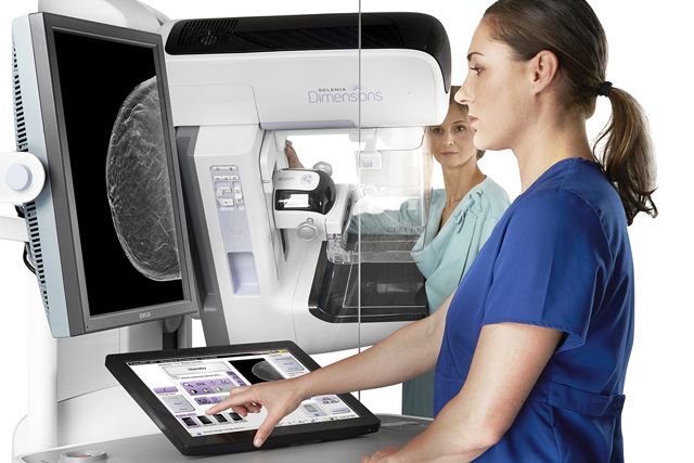 A patient undergoes a 3-D mammogram. (Credit: Photo courtesy of Hologic)