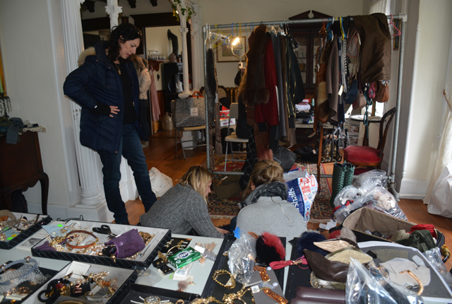 The livingroom of the Ann Curie-Bell House became the staging area for the shoot, as the stylist, trends coordinator and hair stylist set up shop.