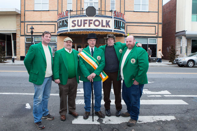 East End Emerald Society members Brandon Hewes, John Cuddy, Grand Marshal Sean McCabe, Richard Stephenson and Sean O'Neill in front of the Suffolk Theatre. Member Walter McGee (not pictured) was unable to attend.