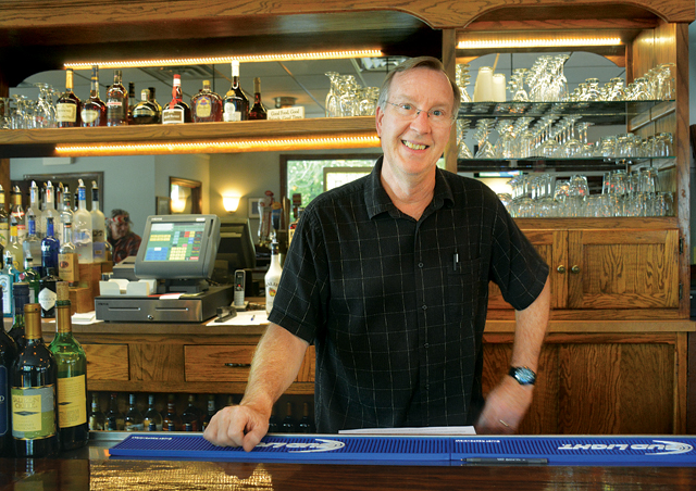 Tom Drake behind the bar at Pulaski Street Grille. (Credit: Monique Singh-Ruy)