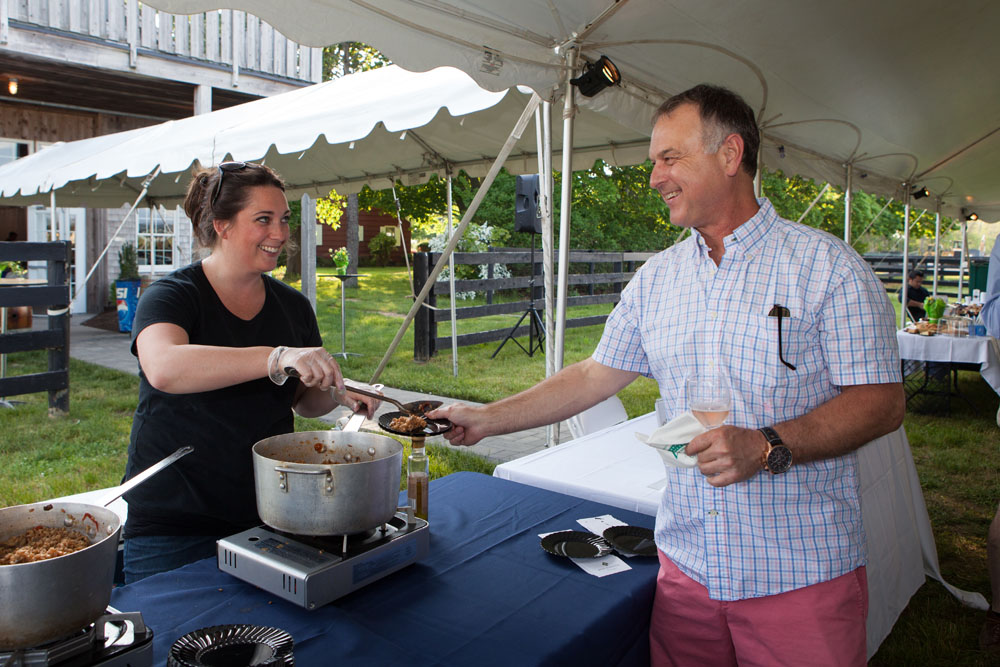 Courtney Schaudel from The Petulant Wino serves Philippe Millen of Laurel. (Credit: Katharine Schroeder)