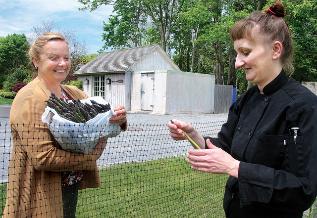 Katie Sepnoski of Sep's Farms in East Marion delivers freshly picked asparagus to Chef Kasia. (Credit: Barbaraellen Koch)